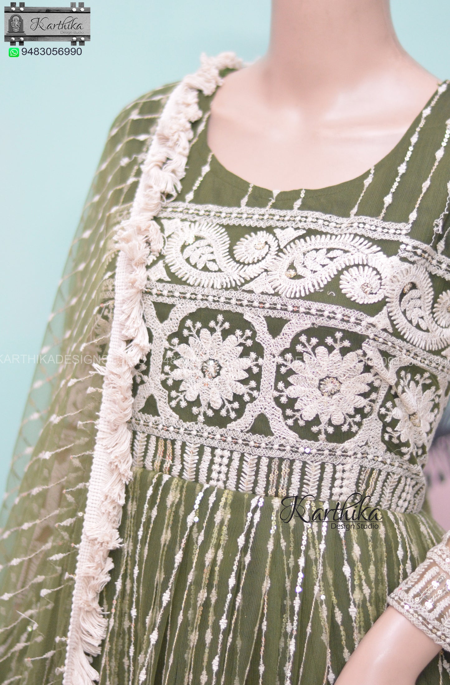 Bottle green embroidered net chudidhar