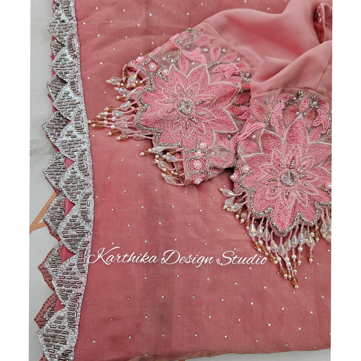 Onion pink Jimmy Choo saree with cutwork border and attached blouse piece