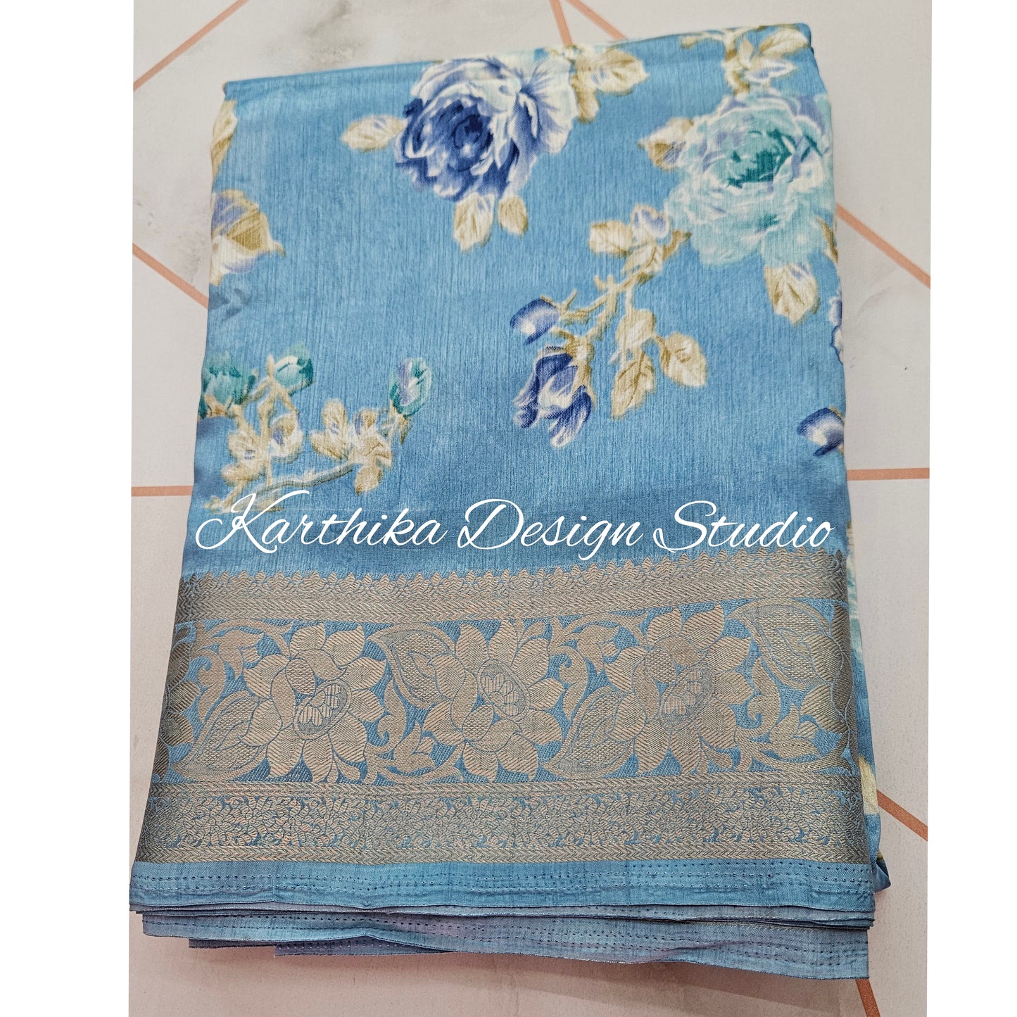 Light blue floral cotton jute saree with zari border