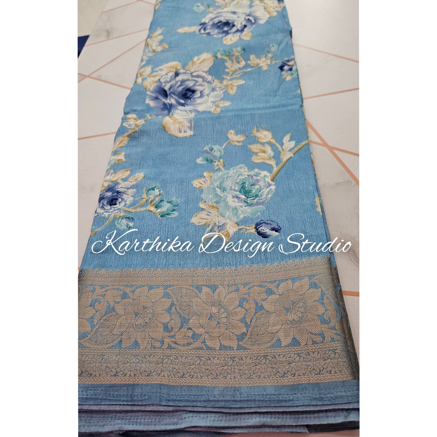 Light blue floral cotton jute saree with zari border