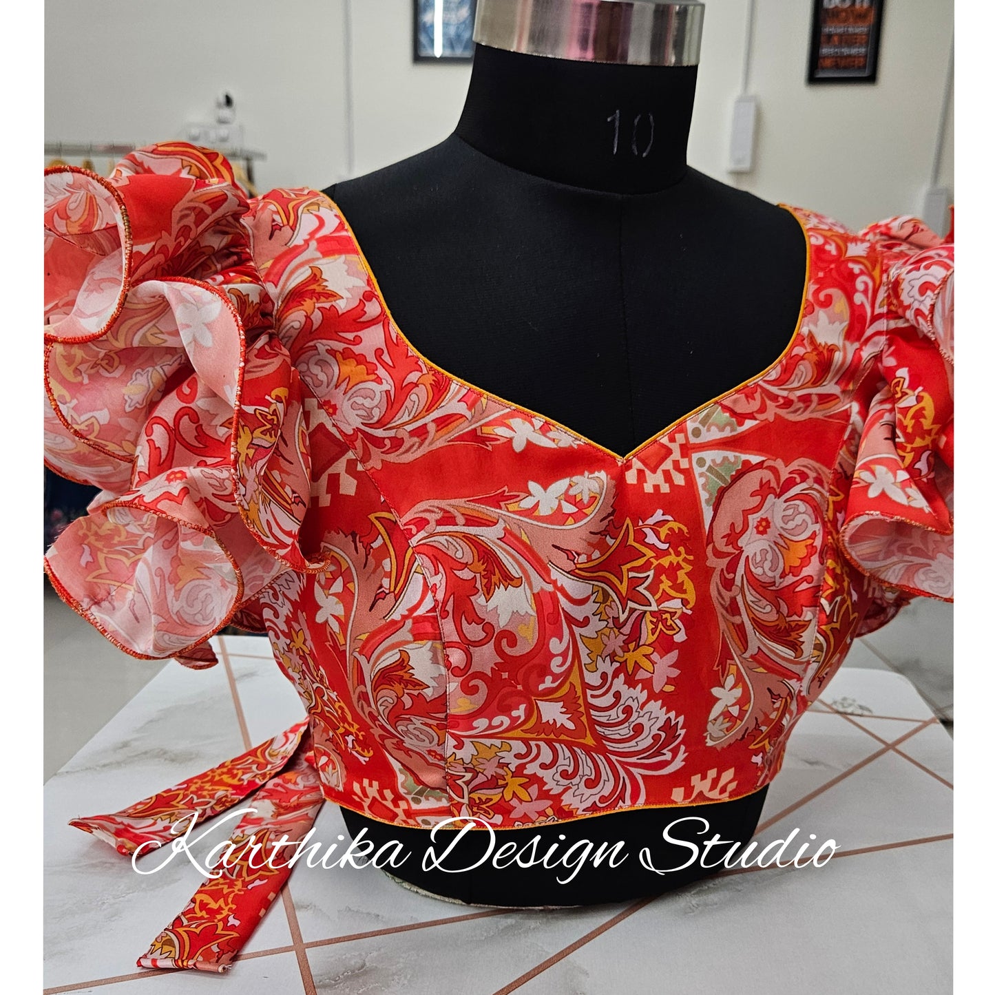Orange floral satin blouse