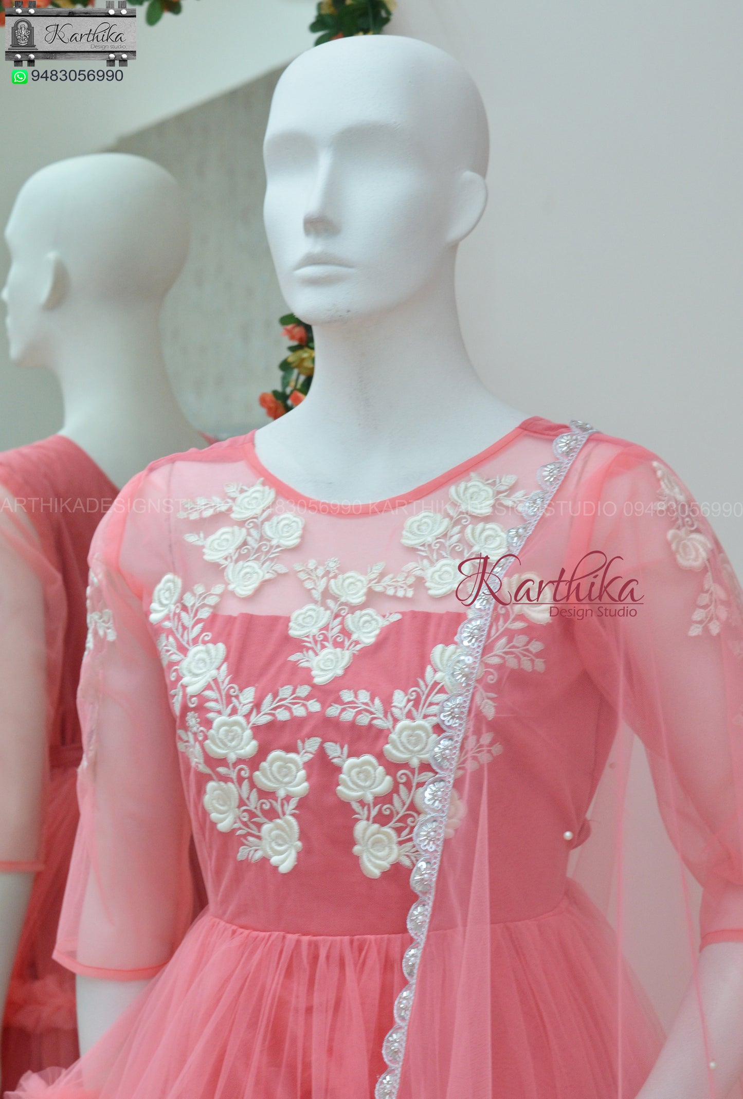 Embroidered peach net long gown..