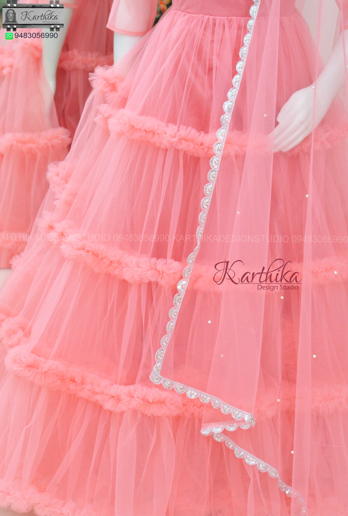 Embroidered peach net long gown..