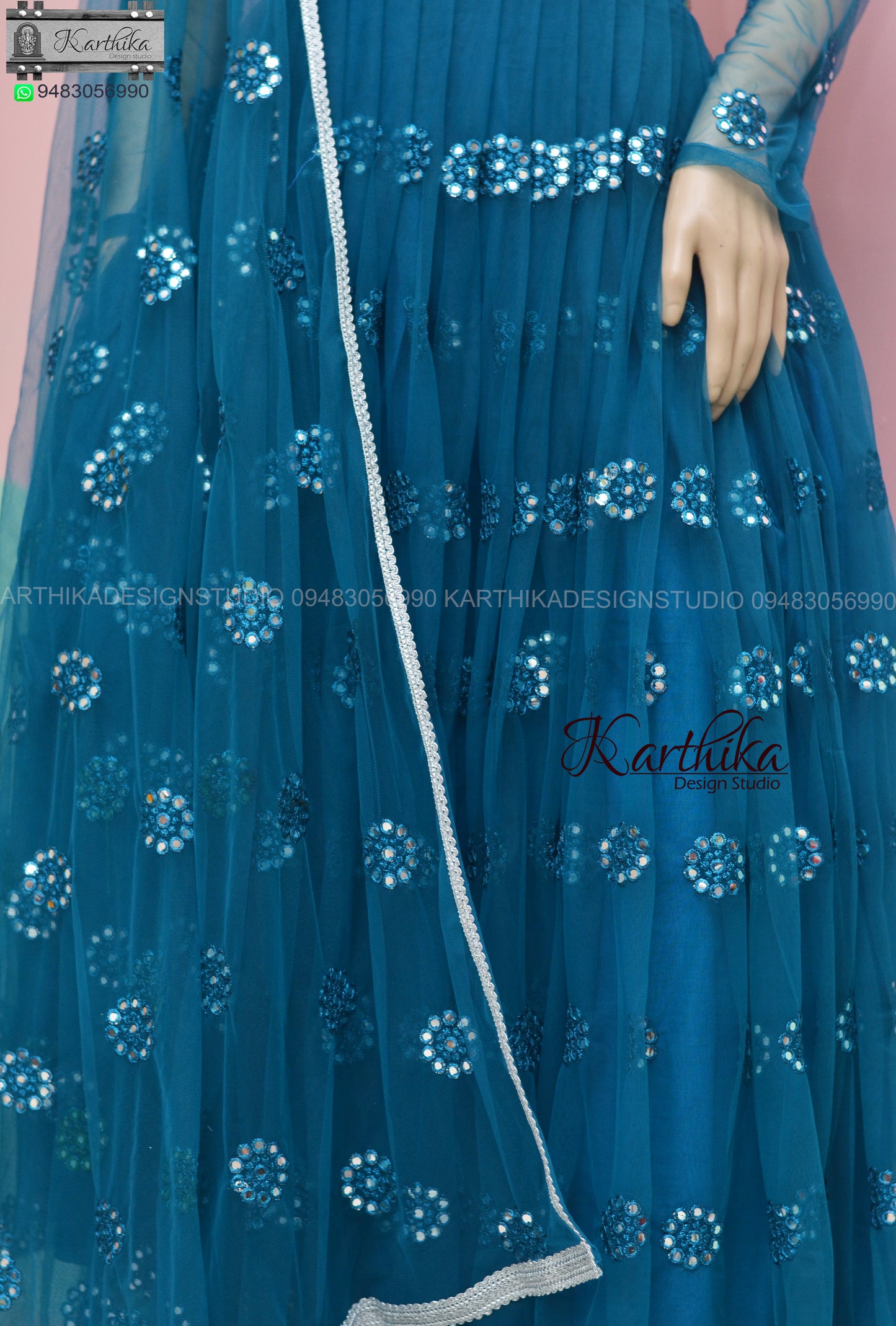 Teal blue embroidered net long gown..