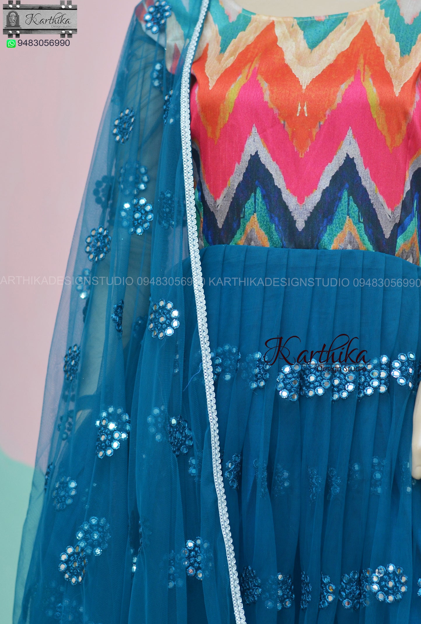 Teal blue embroidered net long gown..
