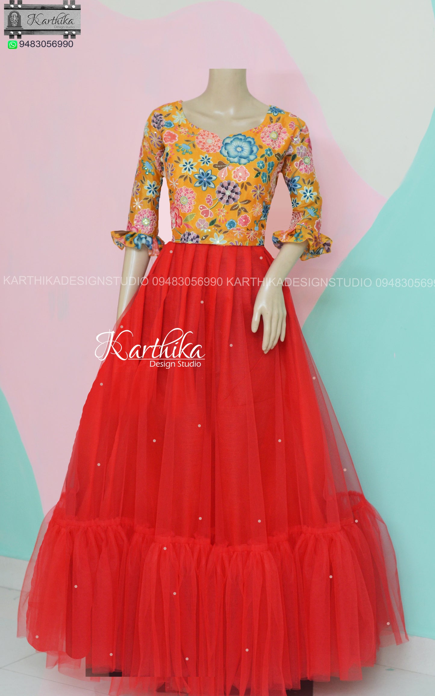Yellow Embroidered chinnon and red net long gown..