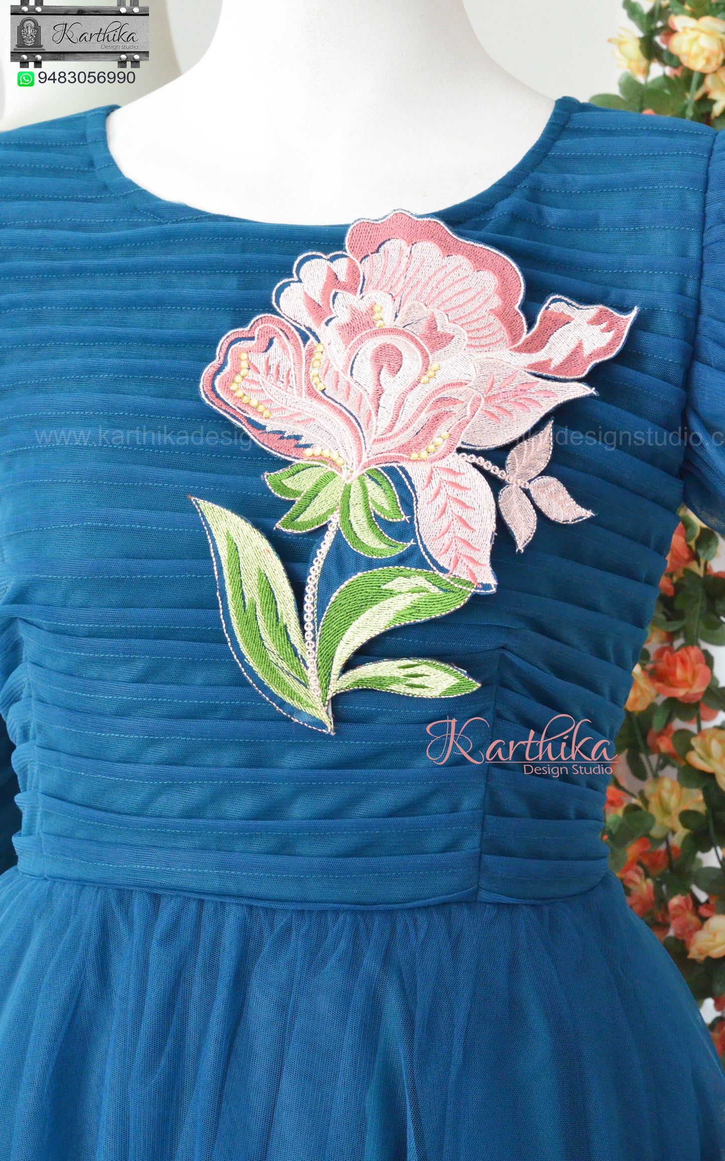 Embroidered Teal blue net long gown..