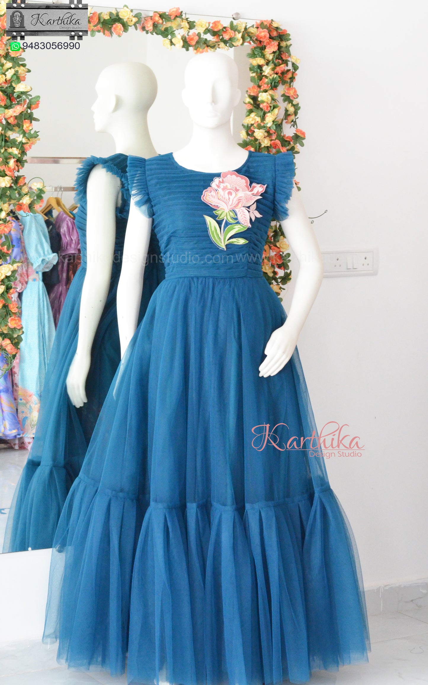 Embroidered Teal blue net long gown..