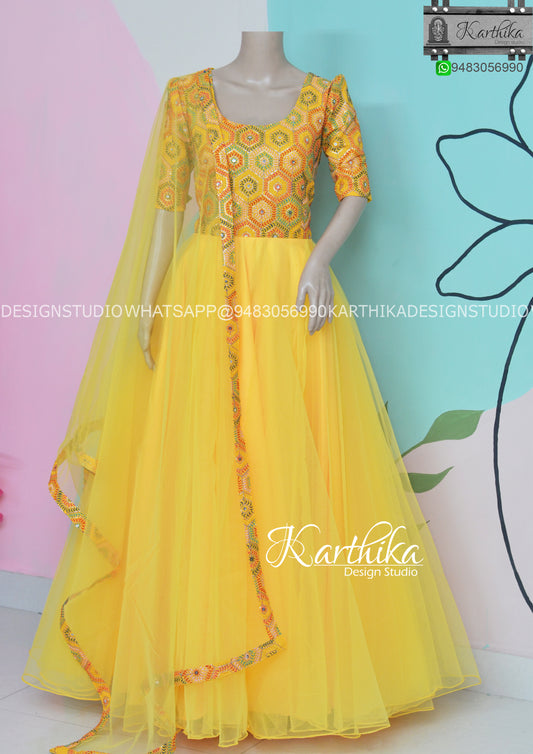 Yellow embroidered georgette long gown..