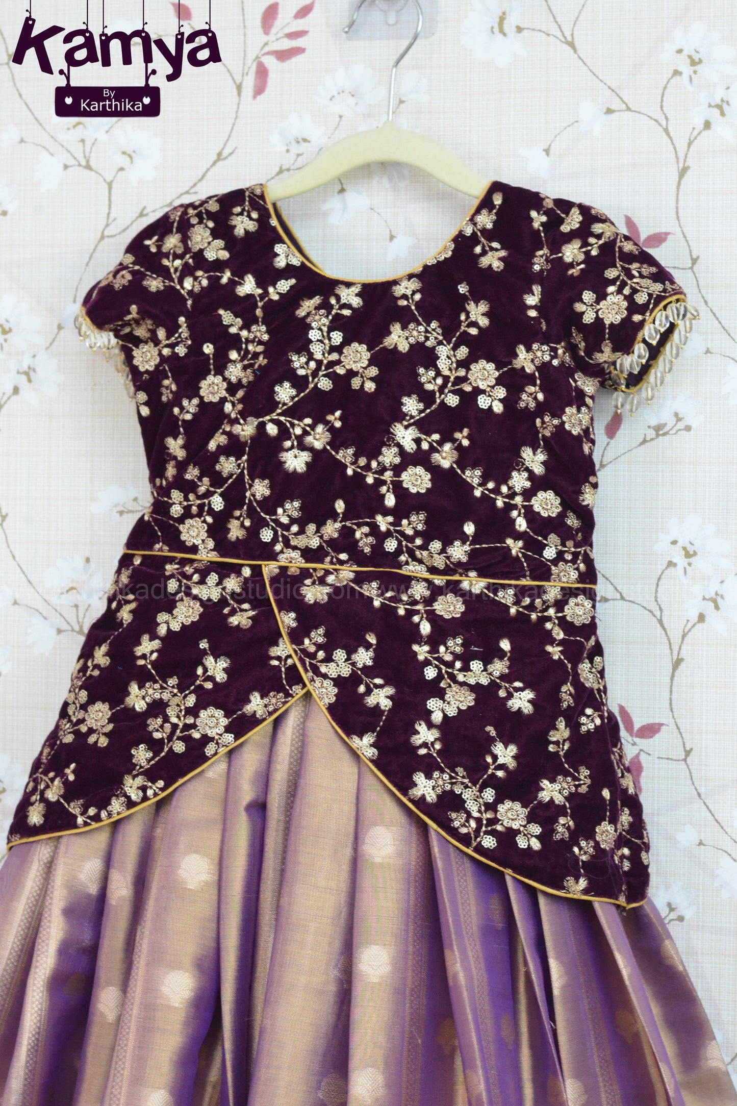Embroidered velvet blouse with soft tissue lehenga