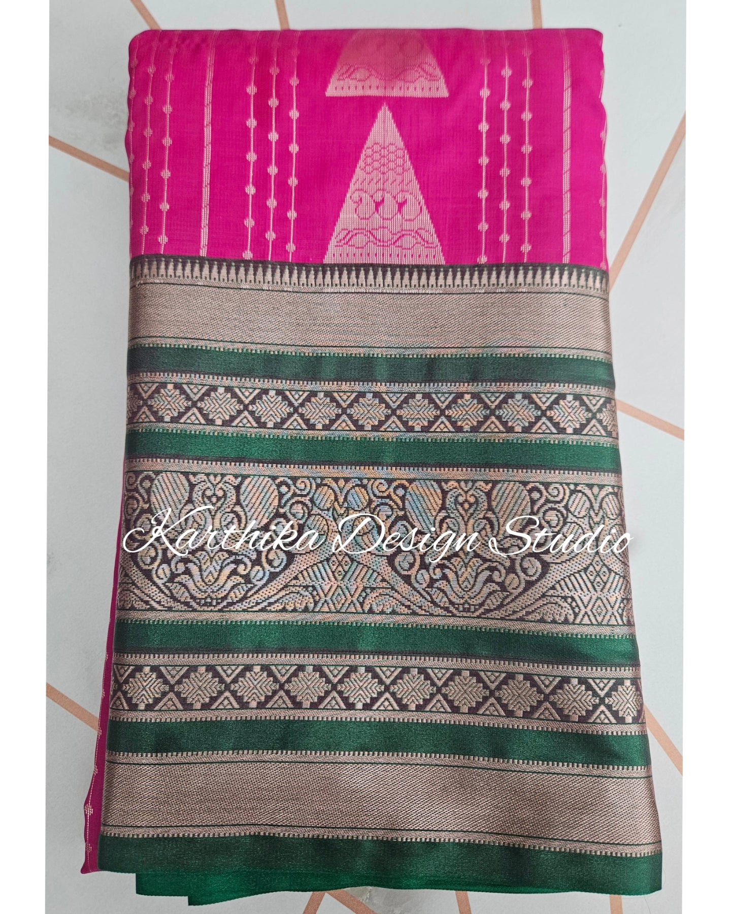 Bright pink and green silk saree