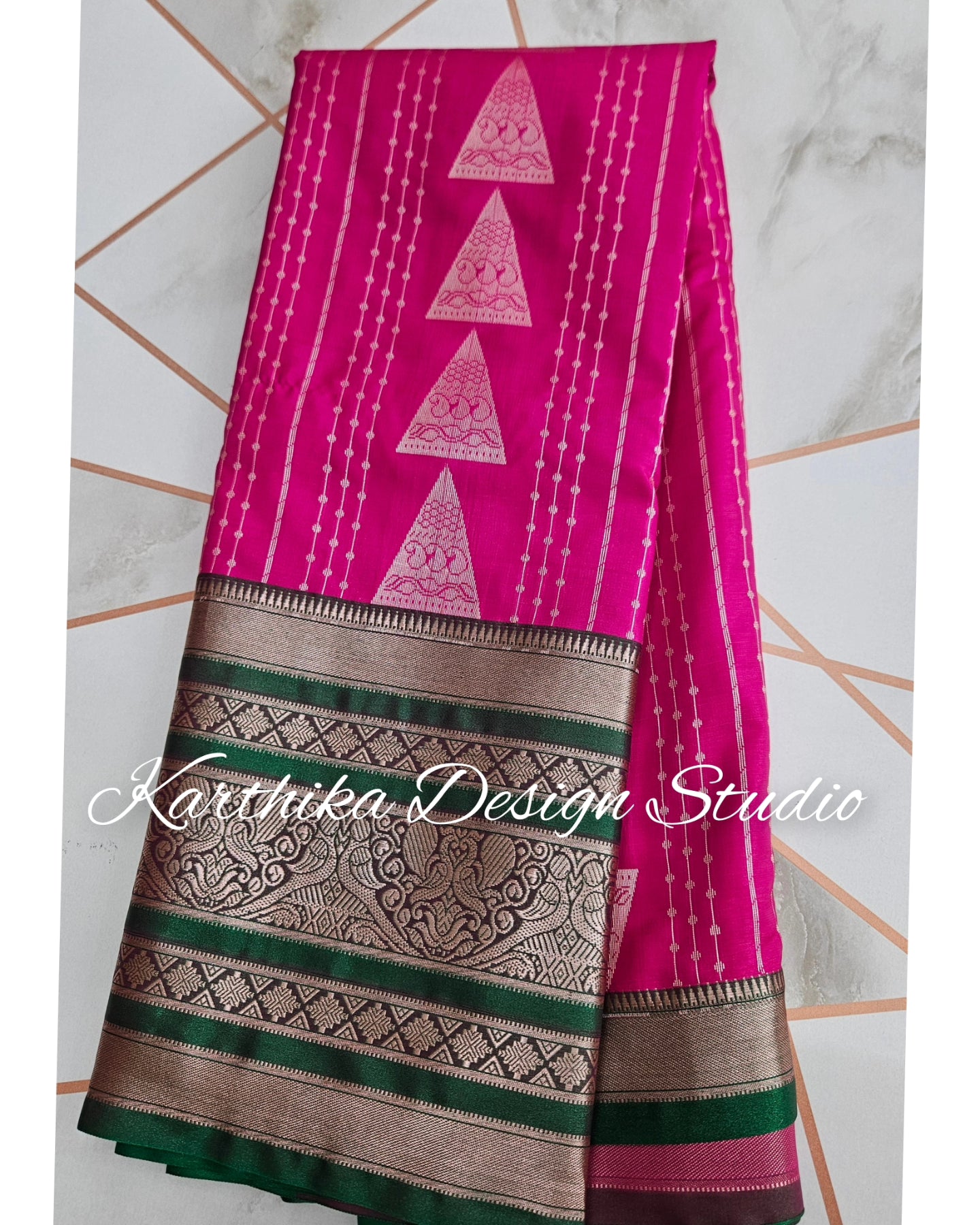 Bright pink and green silk saree