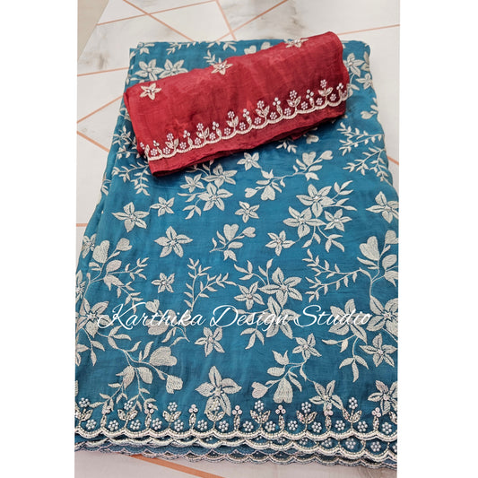 Teal blue Jimmychoo saree with cutwork border and overall embroidery