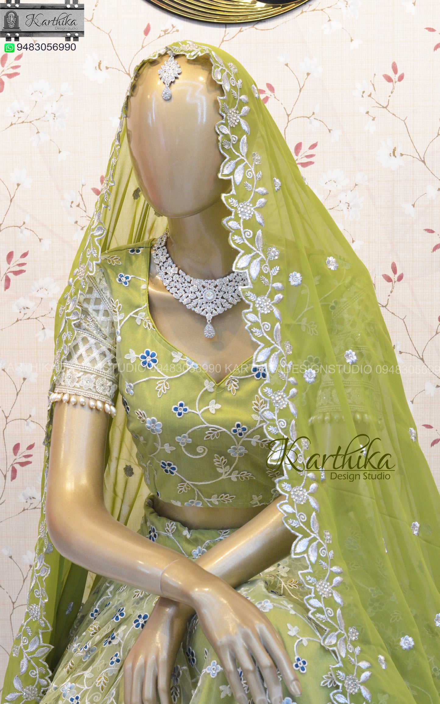 Olive green embroidered net lehenga