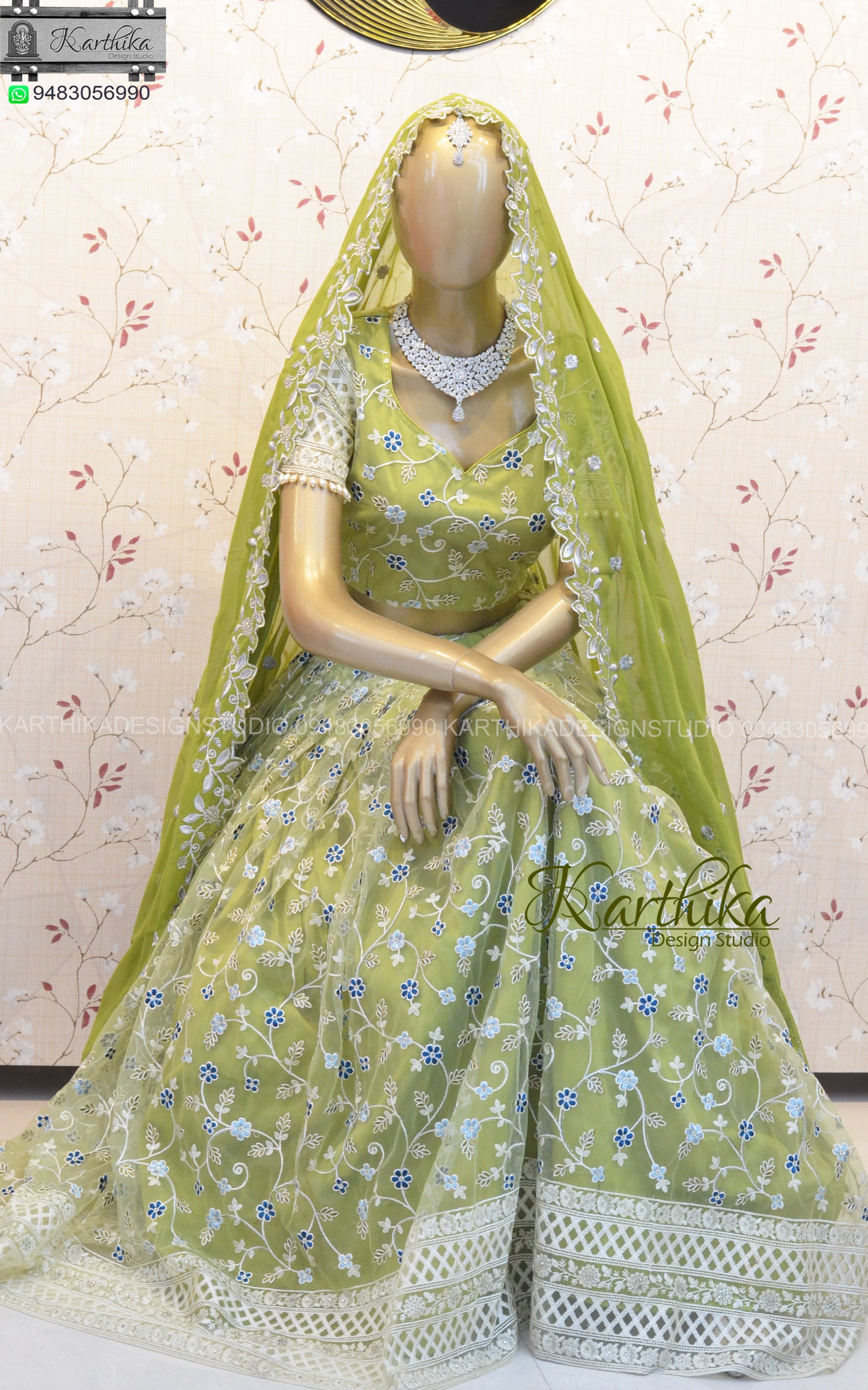 Olive green embroidered net lehenga