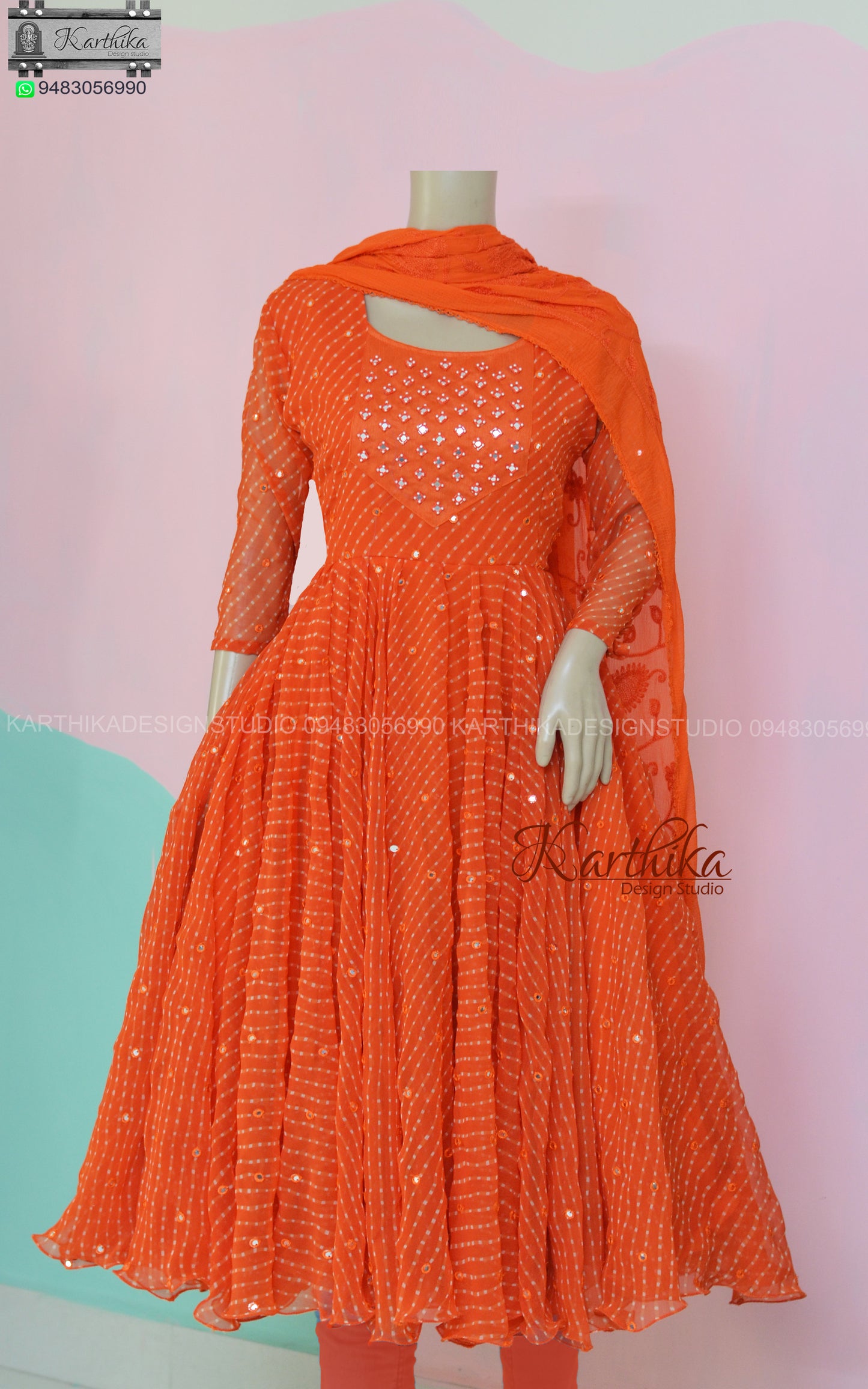 Orange bandhani anarkali with mirror work..