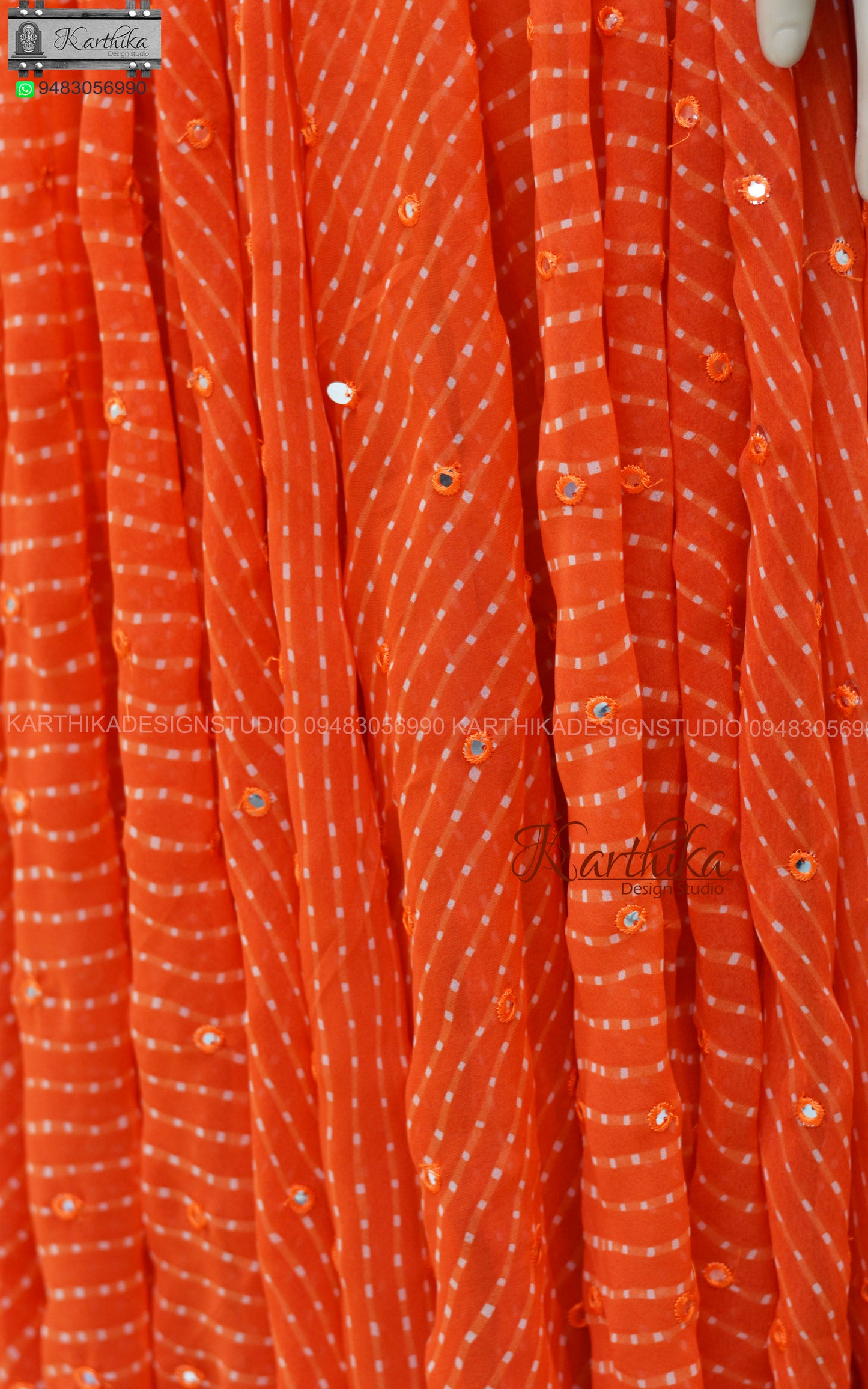 Orange bandhani anarkali with mirror work..