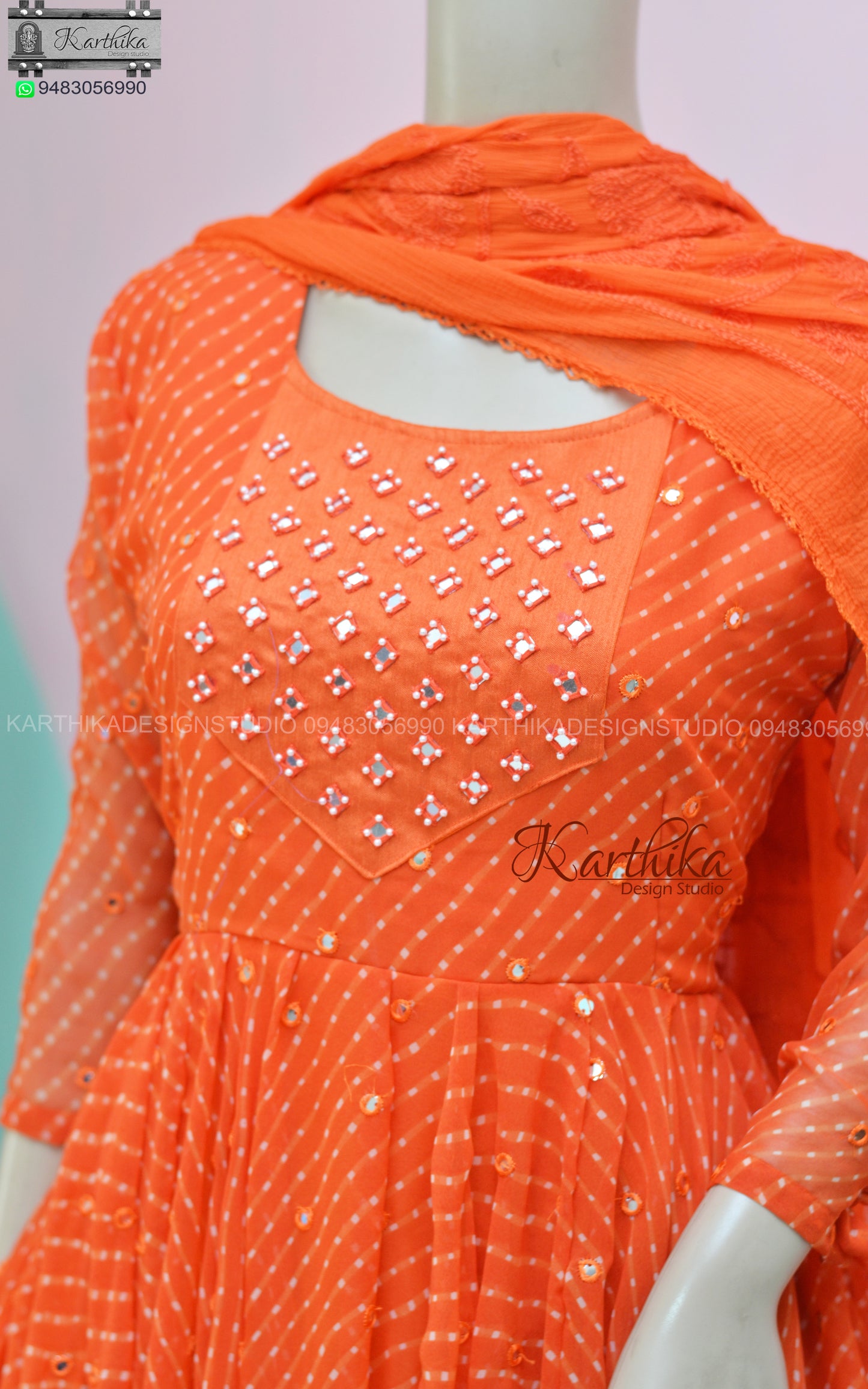 Orange bandhani anarkali with mirror work..