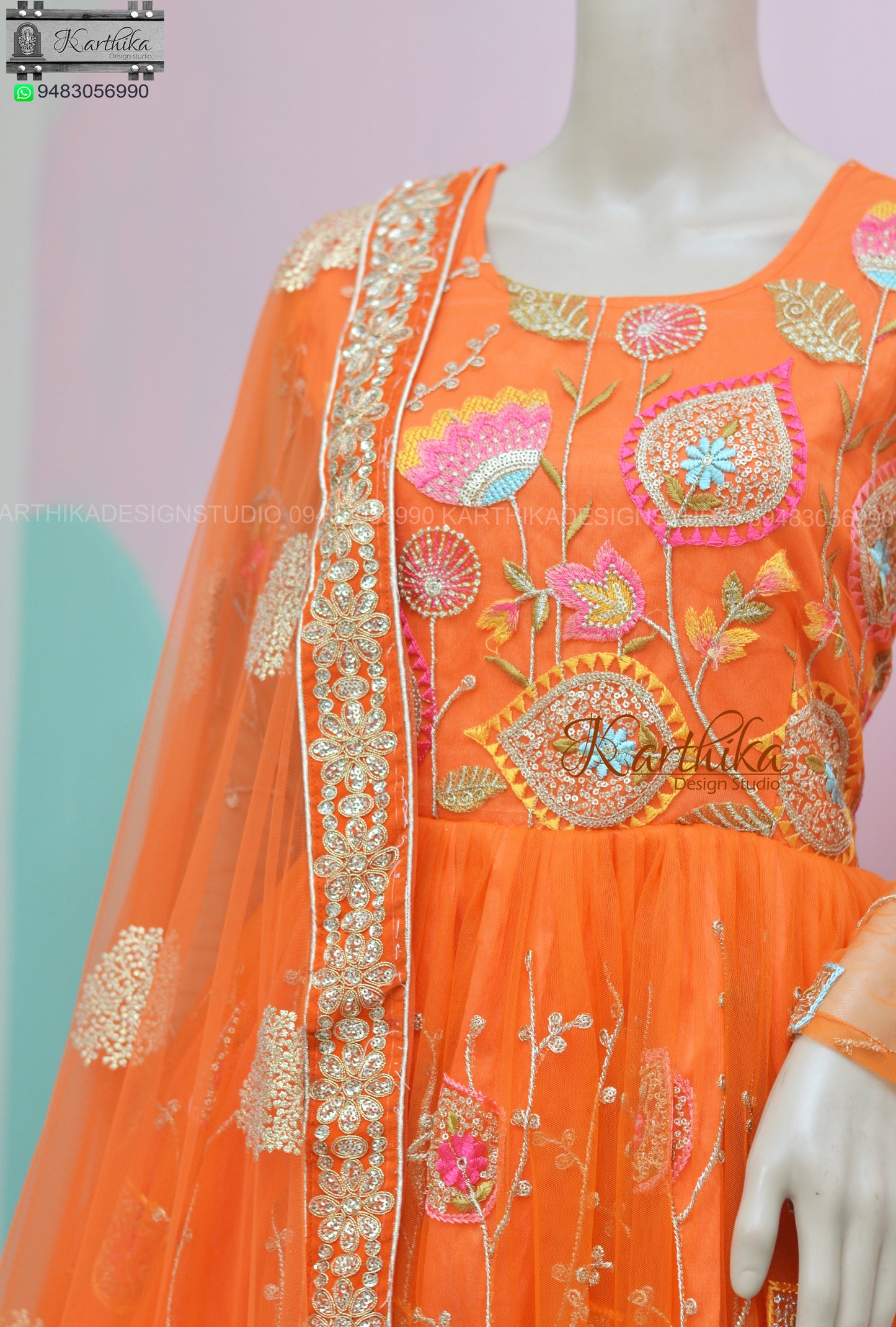 Orange embroidered net long gown..