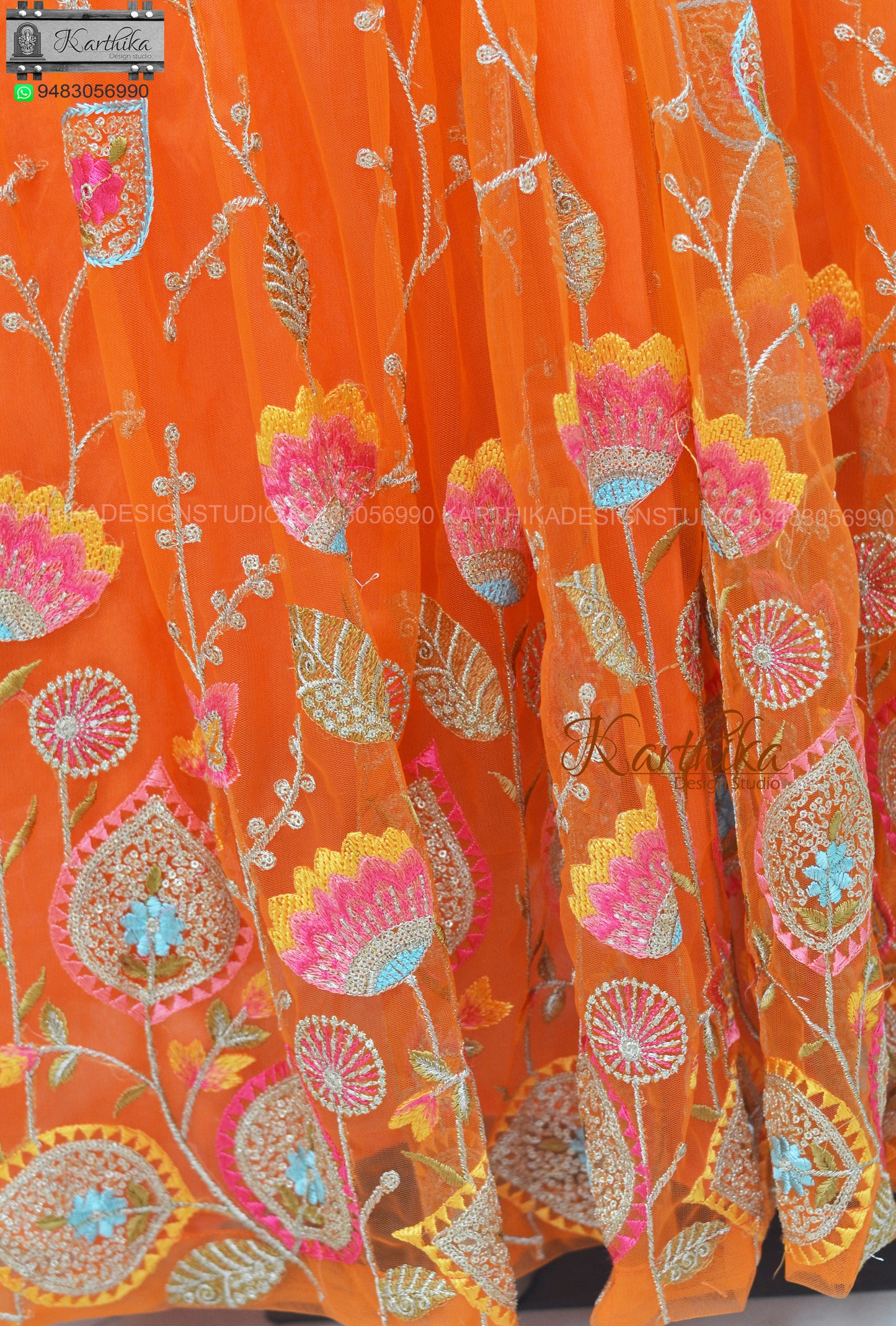 Orange embroidered net long gown..