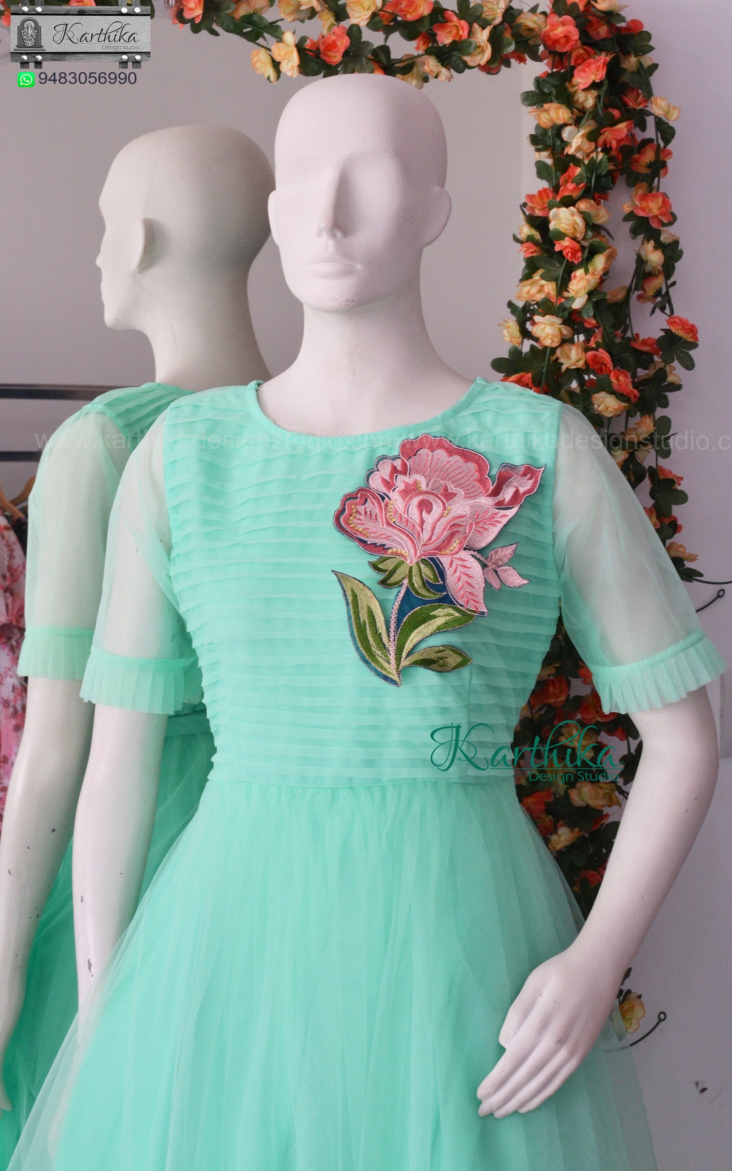 Pleated net frock with applique work