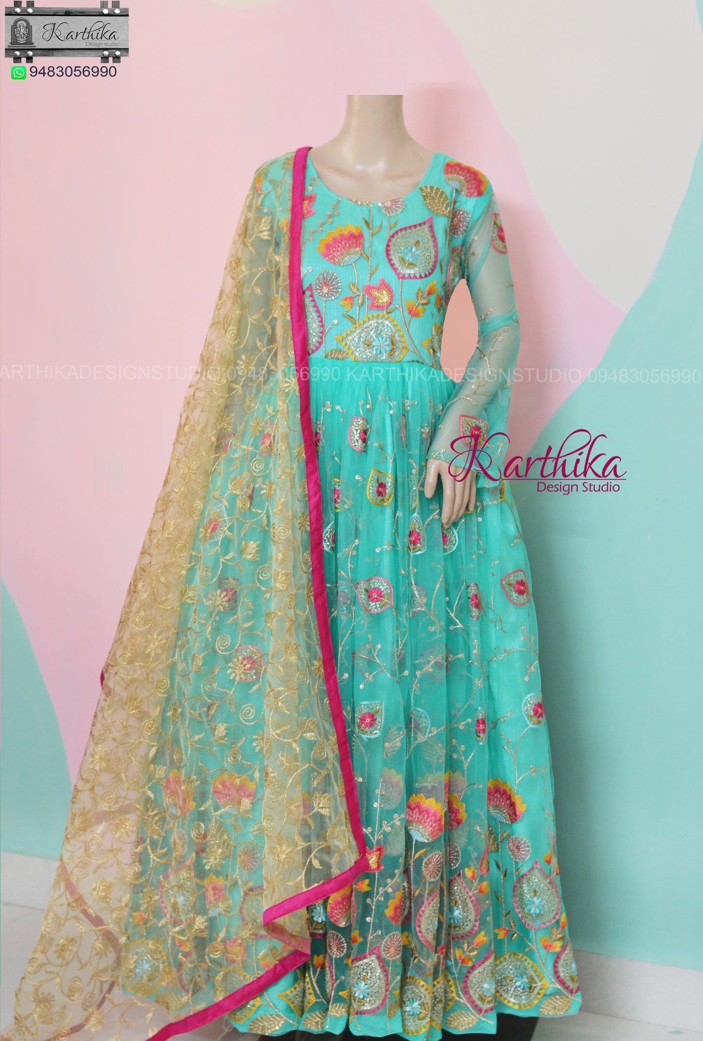 Sea Green embroidered net long gown..