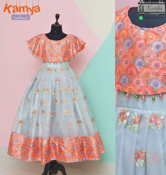 Organza frock with cape.